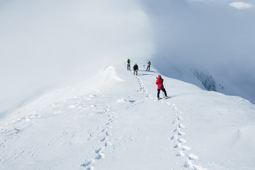Fototapeta na wymiar Footprints in snow behind climbers in Gorgany mountains