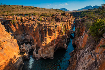 A wide shot of Bourke’s Luck Potholes in Mpumalanga, South Africa; a geological formation carved...