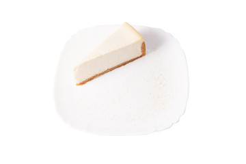 Classic cheesecake on a white plate isolated on white