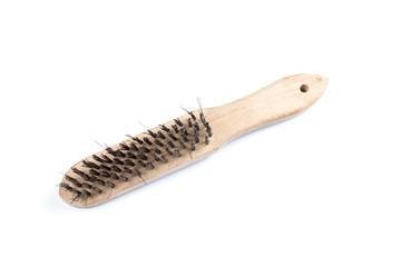 Wooden wire brush isolated on a white background. Strong brush for rust removal. Industrial wire brush.
