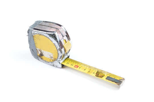 Old And Worn Out Yellow Measure Tape On A White Background, Surface. Industrial Measure Tape.