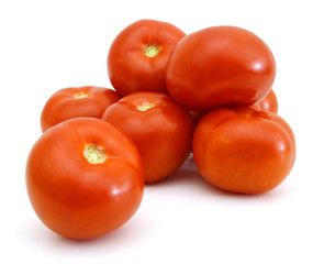 Closeup of tomatoes on the vine isolated on white