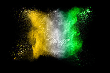 Fototapeta na wymiar Color Holi powder splattered in Indian festival. Color powder explosion. Flag of India made with colorful powder splash isolated on black background.