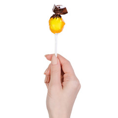 Lolipop in hand on white background isolation