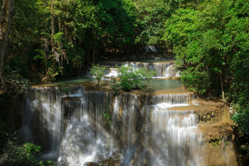 Fototapeta na wymiar Huay Maekamin Waterfall Tier 4 (Chatkaew) in Kanchanaburi, Thailand; photo by long exposure with slow speed shutter