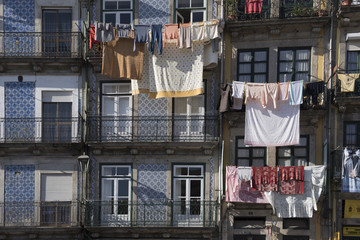 Old row houses with laundry on the balcony in Lisbon, Portugal
