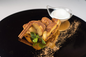 Apple dessert with cinnamon and ice cream