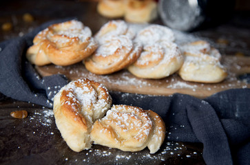 Homemade Palmiers (elephant ear), puff pastry cookie on a wooden board. 