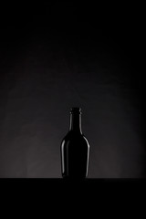 black bottle on a dark background