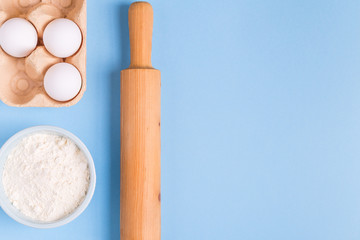 Ingredients for baking  on a blue background.