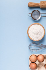 Ingredients for baking  on a blue background.