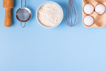 Ingredients for baking  on a blue background.