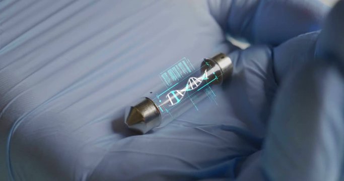 A scientist in his laboratory holds a test tube containing DNA and is able to control the evolution of man thanks to holography. Concept of: DNA, technology, augmented reality.