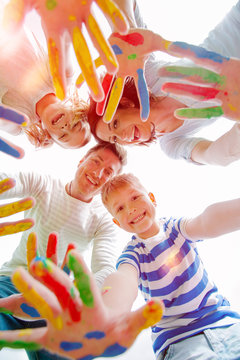 summer family with colour hands