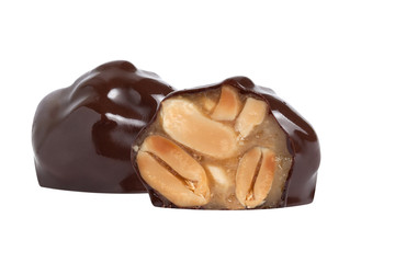 chocolate candy macro shot with nuts and delicious filling on white background, isolates