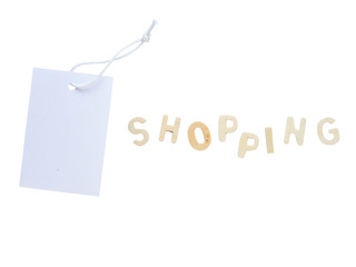 One white paper clothes tag with word shopping isolated background