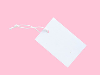 One white paper clothes tag pastel background