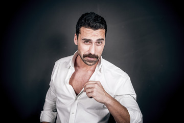 Young handsome man with beard and mustache studio portrait