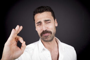 Young handsome man with beard and mustache studio portrait