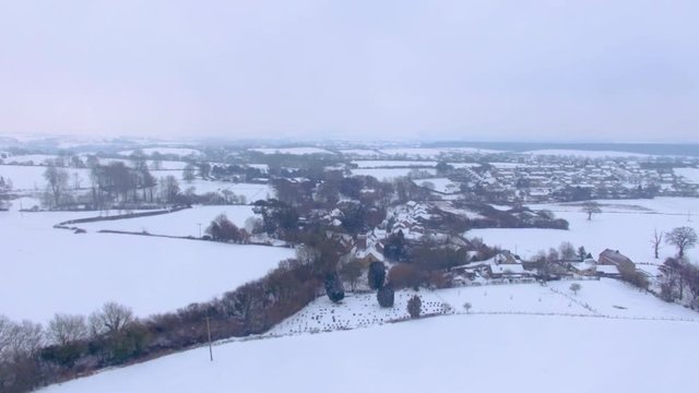 Snowy winter aerial scene fields Britain