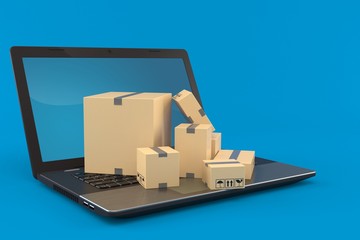 Laptop with stack of boxes