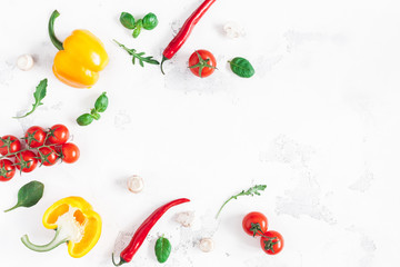 Healthy food on white background. Vegetables, tomatoes, peppers, green leaves, mushrooms. Flat lay, top view, copy space