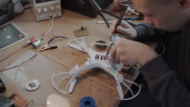close up of a technician fixing drone