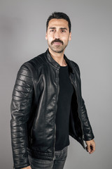 Obraz premium Young handsome man with beard and mustache studio portrait