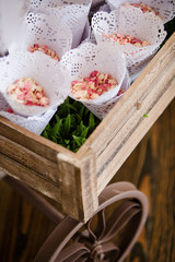 Small Pink Flower Petal Confetti in White Doily Cones in Wood Wagon