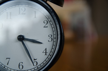 Retro alarm clock  on wood table