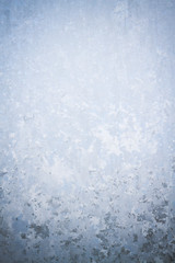 Winter frosty patterns on the frozen ice window