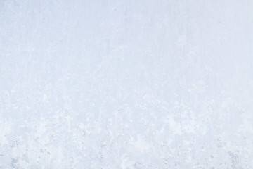 Winter frosty patterns on the frozen ice window
