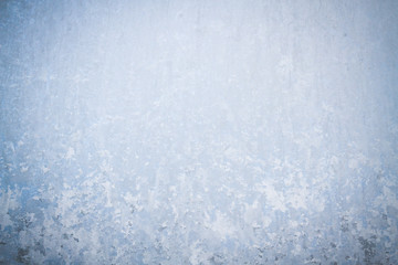 Winter frosty patterns on the frozen ice window