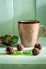 Close up of cup of tea on a vintage wooden background (Taste, thirst, drink concept)