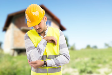 Work injury and painful elbow concept with construction worker.