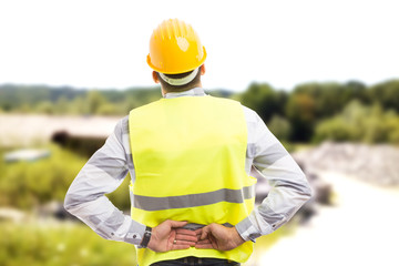 Injured construction worker or engineer suffering backpain.