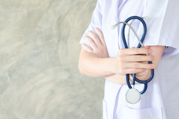  doctor posing in the office, She is wearing a stethoscope, medical staff on the hospital background