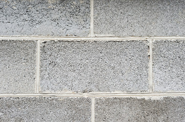 The texture of the wall is the laying of expanded clay blocks. Background for the advertisement of building materials. Close-up Gray concrete foam block.