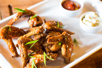 Grilled chicken wings with hot sauce