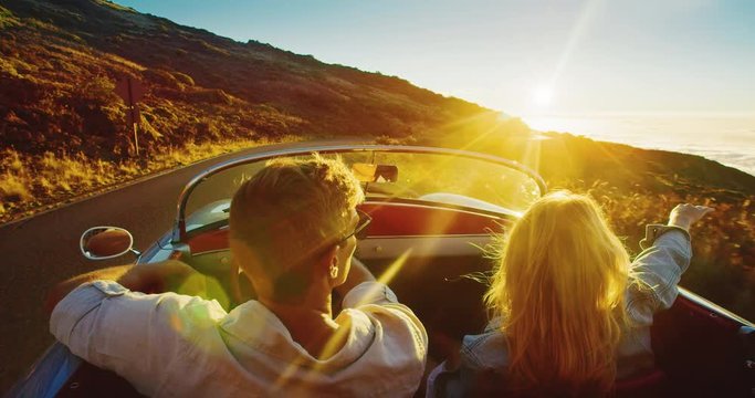 Driving Into The Sunset, Romantic Couple Enjoying Beautiful Drive On Country Road In Cinematic Slow Motion