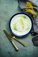 Spring table setting with mimosa flowers