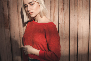 Fototapeta premium Cute young female on wood background