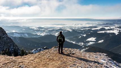 Having fun on a sunny day of winter on Hasmas mountains in Romania.