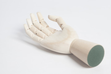 Wooden robot cyborg hand on a white background