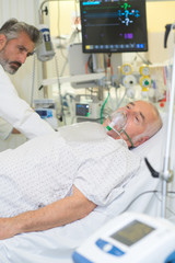 doctor examining his patient at the hospital