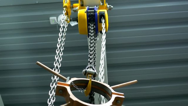 Chain winch lifts copper billet