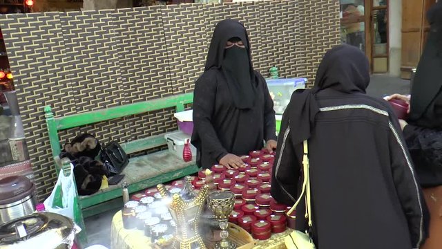 mysterious woman selling cool stuff at the market