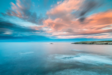 Fototapeta na wymiar the sunsets in the sea of the coasts and beaches of Galicia and Asturias have nothing to envy to other parts of the world, where the spectacular colors of the clouds, rainbows, rays of light, natural 