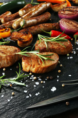 Assorted delicious grilled meat with vegetable on a barbecue