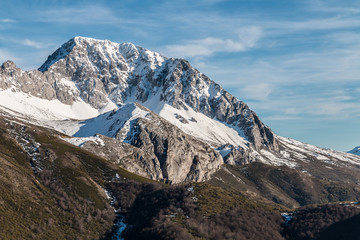 the snowy mountains in winter offer spectacular landscapes especially when the sun and clouds appear highlighting the beauty of nature